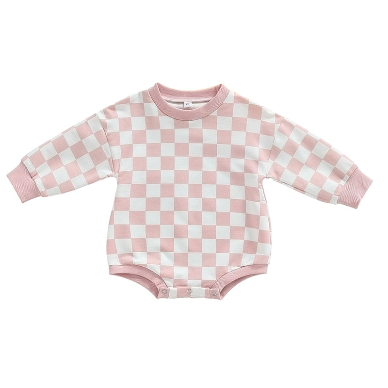 Baby boy and girl fall sweatshirt bodysuit with checkerboard print, long sleeves, from August + Willow, suitable for infants.