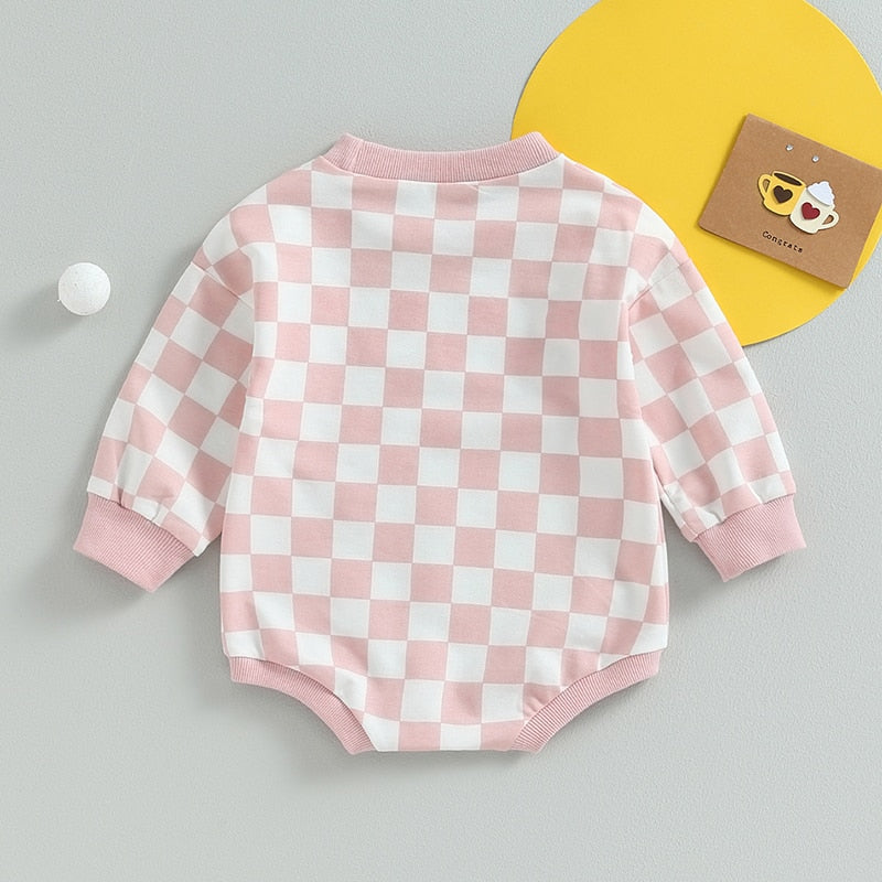 Baby boy and girl fall sweatshirt bodysuit with checkerboard print, long sleeves, from August + Willow, suitable for toddlers.