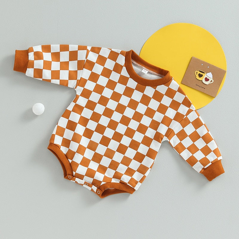 Baby boy or girl fall sweatshirt bodysuit with checkerboard print, long sleeves, from August + Willow, suitable for toddlers.
