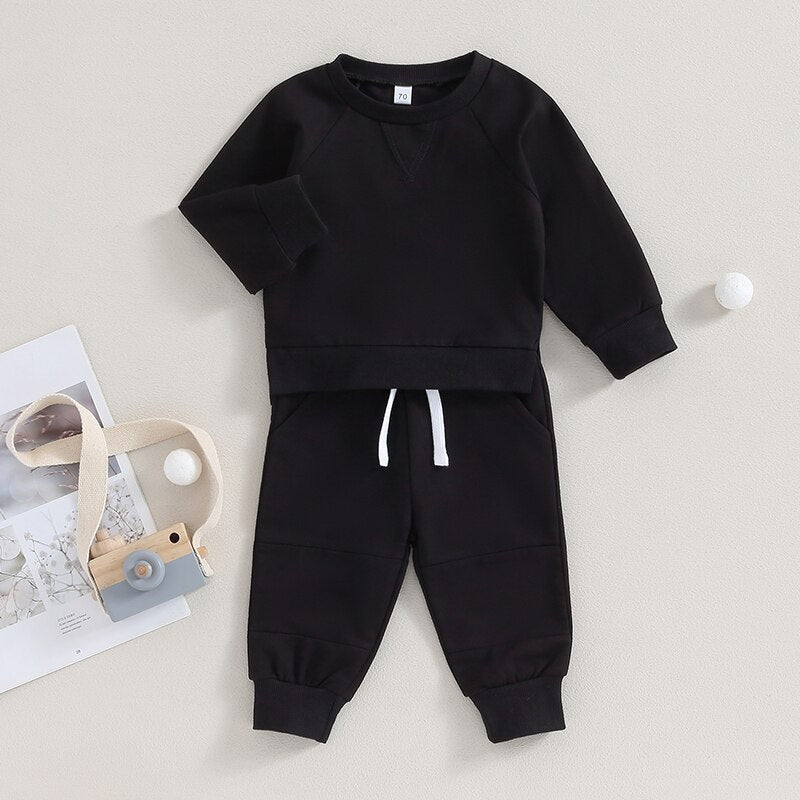 Baby toddler fall outfits set with long sleeve split hem tops and solid color pants, by August + Willow, for boys and girls.