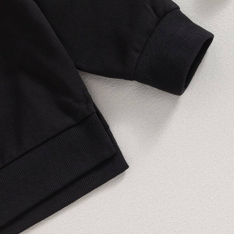 Black toddler baby boys and girls fall outfits with long sleeve split hem tops and pocket pants in solid color, by August + Willow.