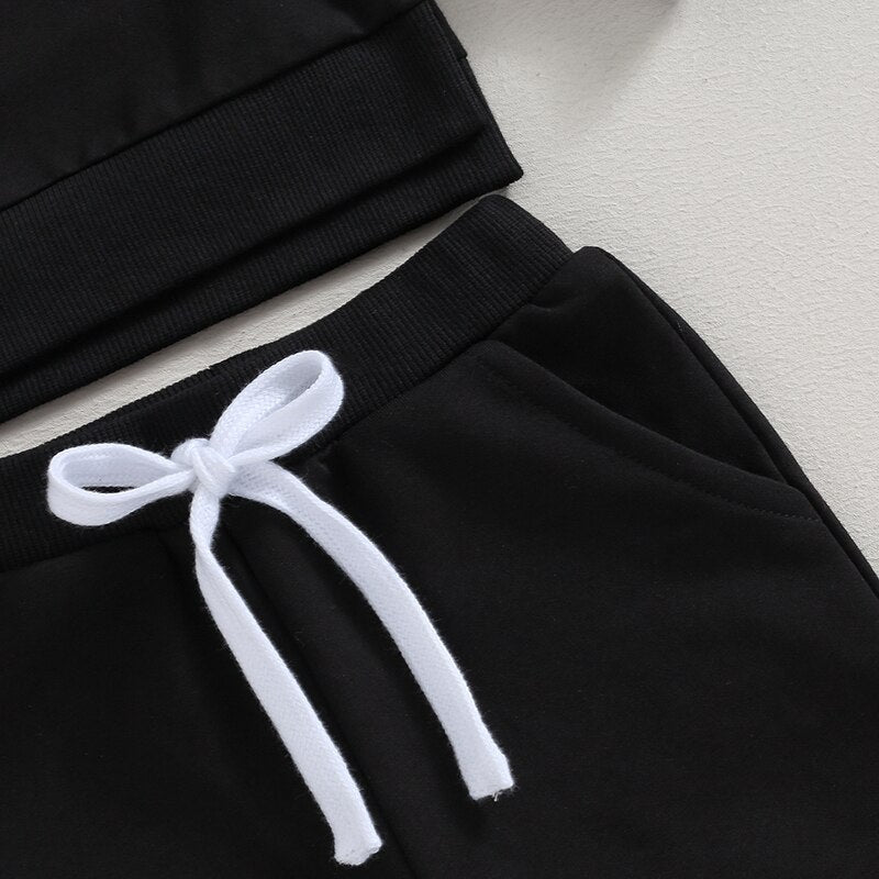 Baby toddler fall outfits by August + Willow with long sleeve split hem tops and solid color pants, suitable for boys and girls.