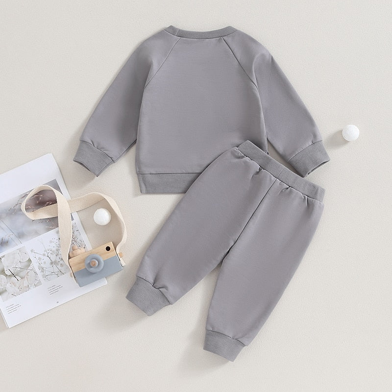 Baby toddler fall outfit set with long sleeve split hem tops and pocket pants in solid black, by August + Willow.