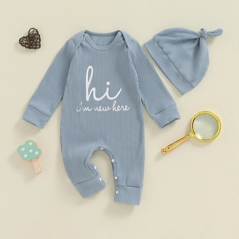 Baby boys and girls 2-piece romper and hat set by August + Willow, blue long-sleeve jumpsuit with "Hi I'm New Here" letter print.