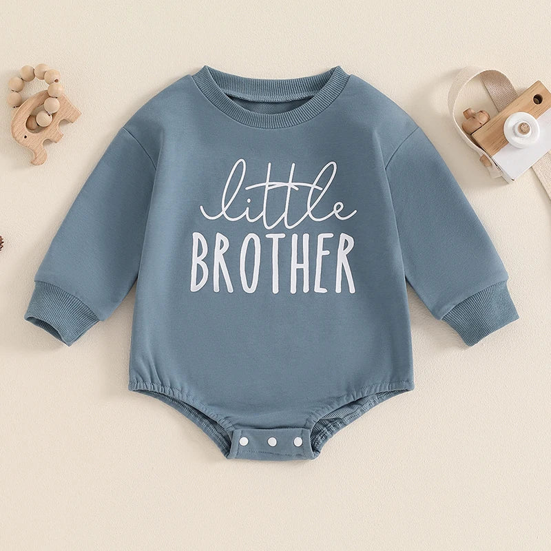 Blue baby boys Little Brother bubble romper by August + Willow, long sleeve bodysuit with letter print and round neck for ages 6-12 months.