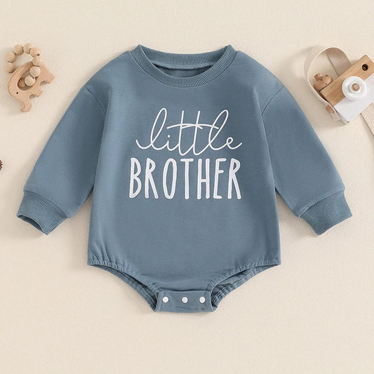 Blue baby boys Little Brother bubble romper by August + Willow, long sleeve bodysuit with letter print and round neck for ages 6-12 months.