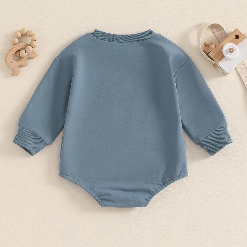 Baby boy bubble romper by August + Willow in blue with letter print, long sleeves, round neck, perfect for little brothers.