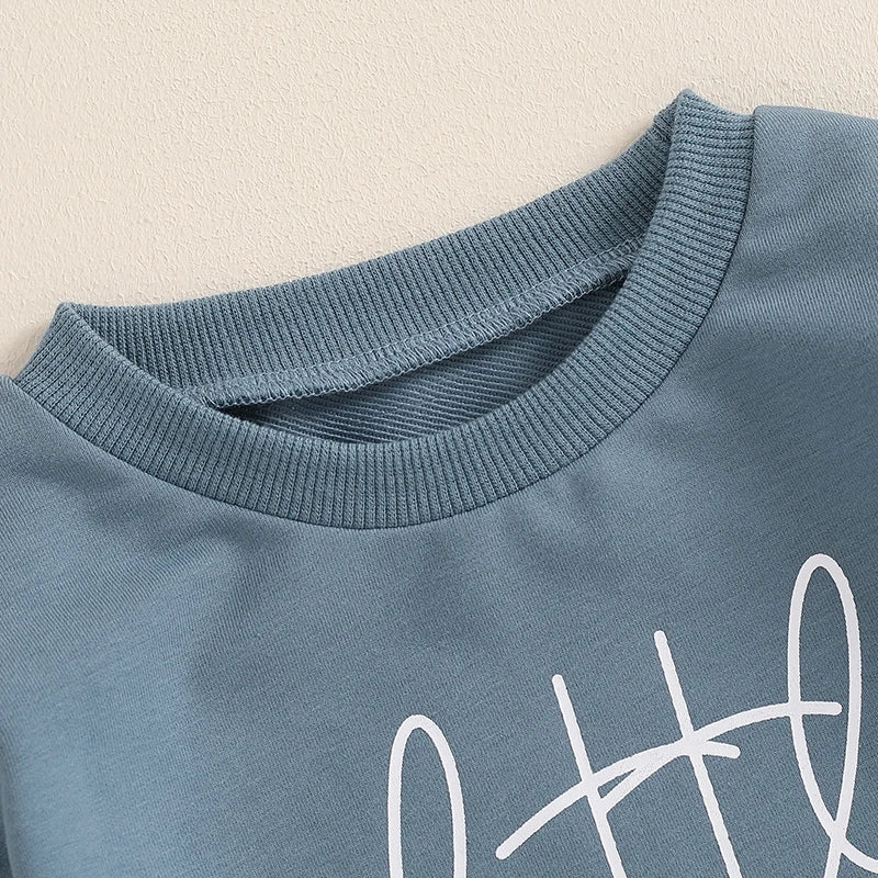 Baby boy's blue bubble romper from August + Willow featuring letter print, long sleeves, round neck, and comfortable bodysuit design.