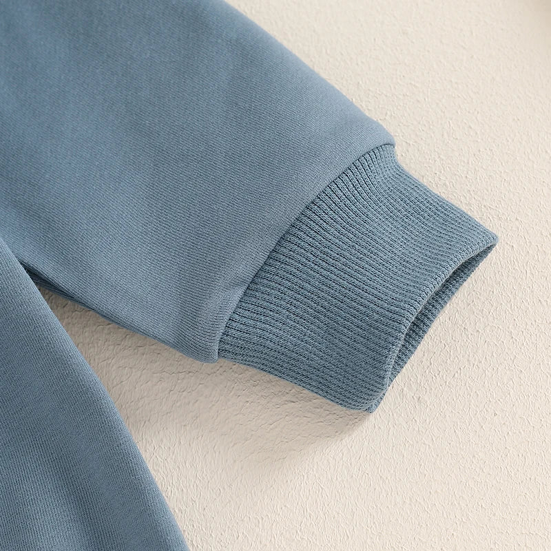 Baby boy's blue bubble romper by August + Willow, long sleeve bodysuit with letter print and round neck, suitable for 6-12 months.