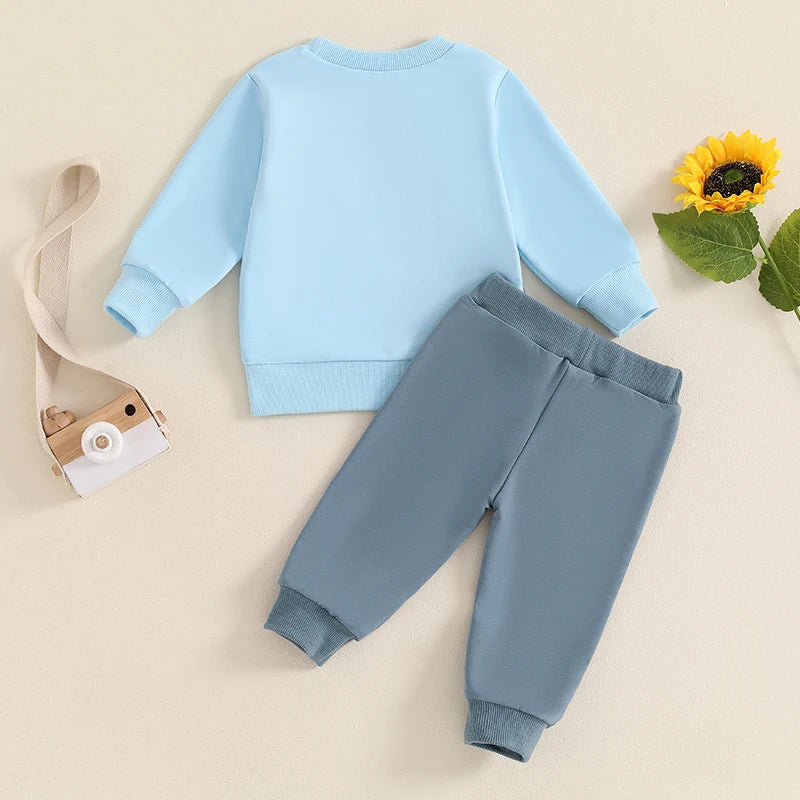 Baby toddler boys fall outfit with long sleeve contrast crewneck top and solid pants set by August + Willow, suitable for ages 6-12 months.