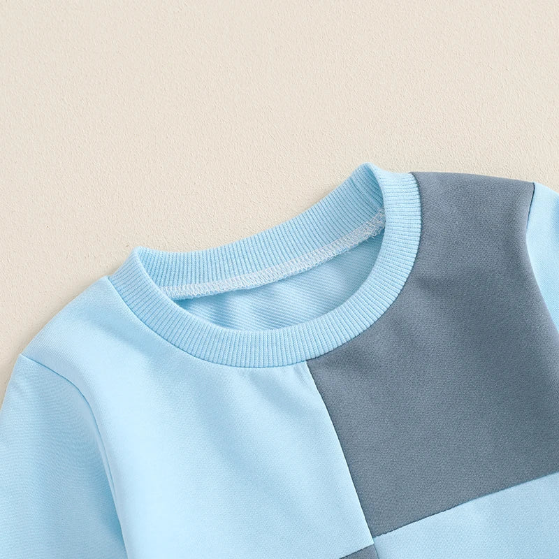 Baby toddler boys 2-piece fall outfit with long sleeve contrast color crewneck top and solid pants by August + Willow.