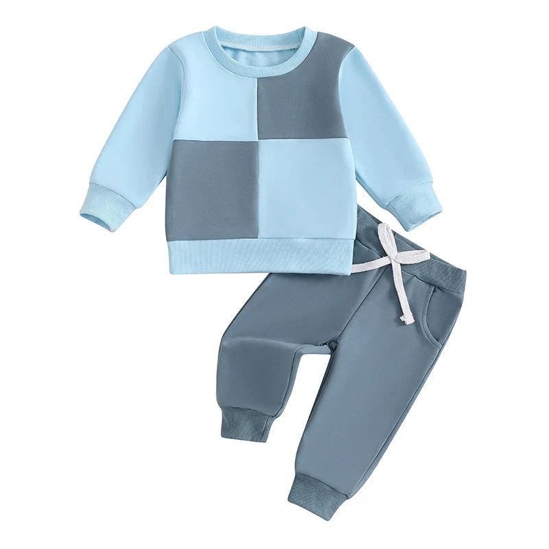 Baby toddler boys fall outfit set by August + Willow with long sleeve contrast color crewneck top and solid pants in blue, 6-12 months.