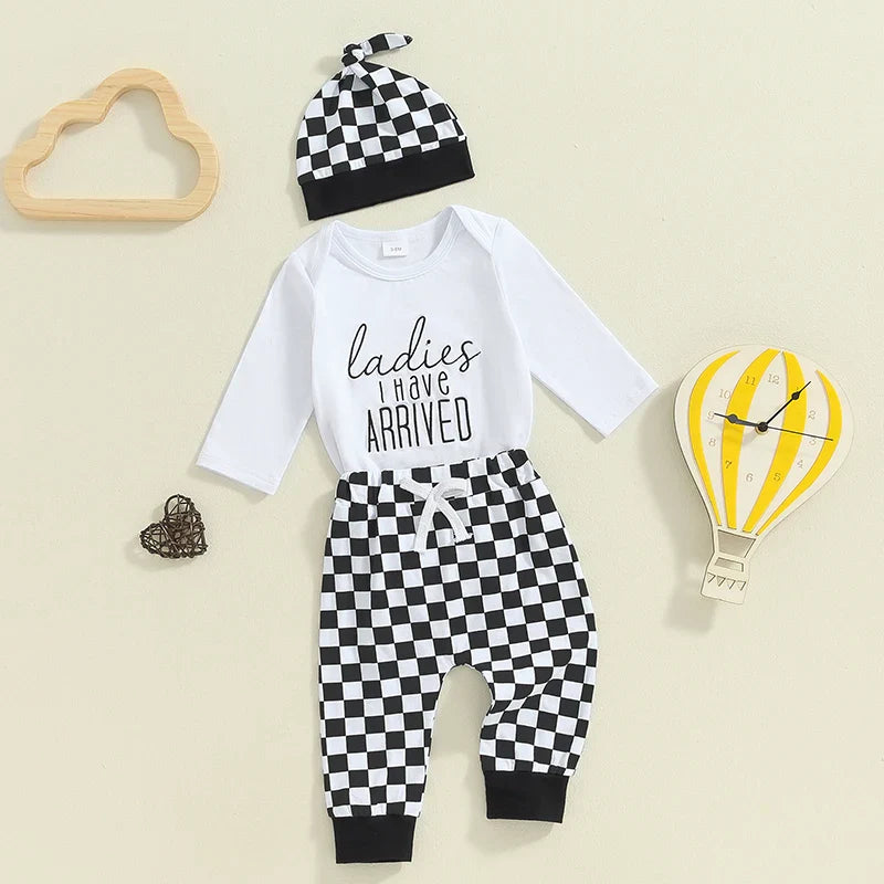 Baby boy fall outfit set from August + Willow featuring a letter print long-sleeve romper, elastic checker pants, and a beanie hat.
