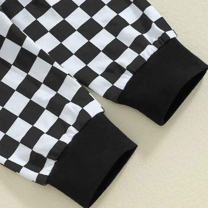 Baby boy fall outfit set by August + Willow with letter print romper, checker pants, and beanie, for ages 3-6 months.
