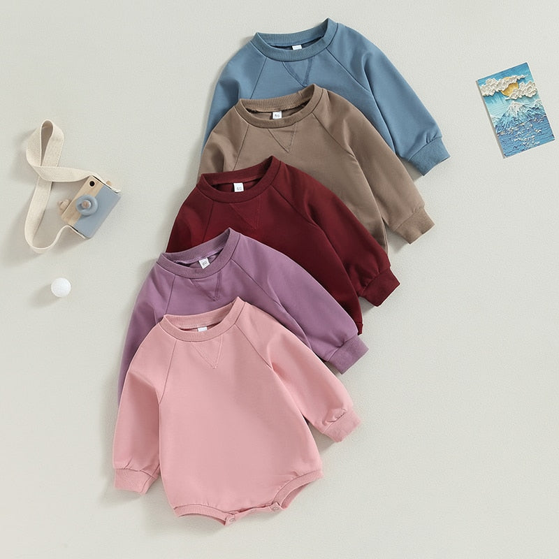 Baby girls and boys burgundy long-sleeve jumpsuit by August + Willow, solid crew neck romper for fall outfits in size 6 months.
