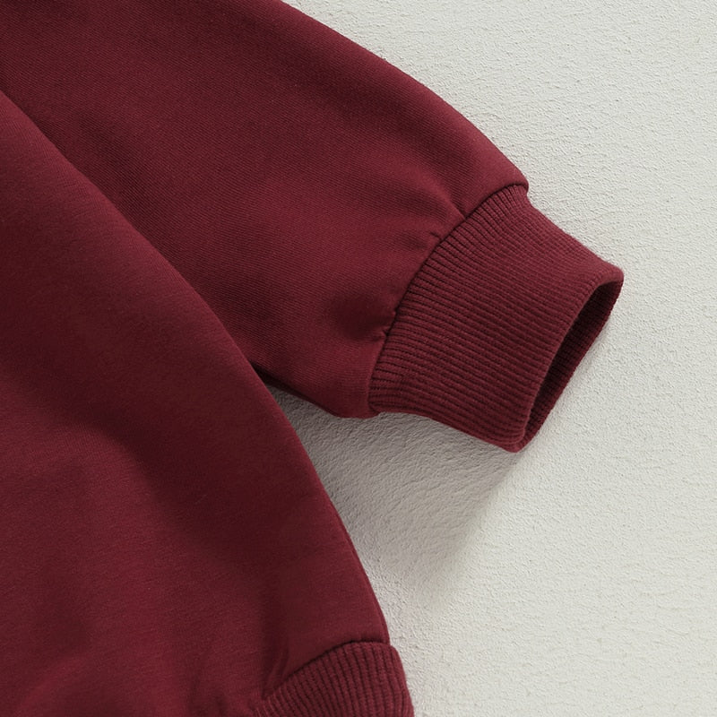 Baby girls and boys burgundy long sleeve bodysuit by August + Willow, crew neck, solid jumpsuit for fall outfits.