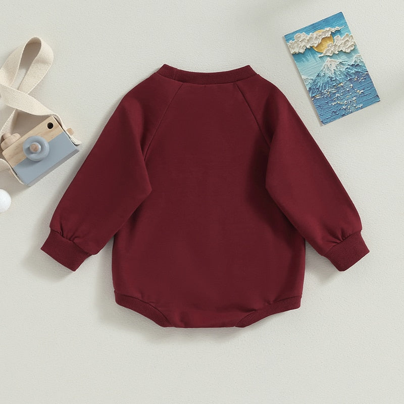 Baby girls and boys long sleeve burgundy romper by August + Willow, solid crew neck jumpsuit for fall outfits.