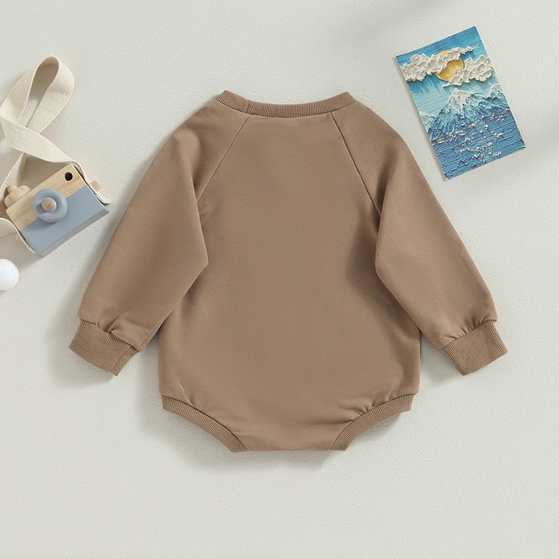 Baby bodysuit by August + Willow featuring solid burgundy long sleeve crew neck jumpsuit for girls and boys, perfect for fall.