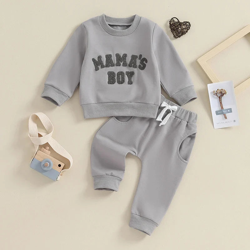 Gray toddler baby boy fall winter 2-piece outfit from August + Willow with long sleeve letter mama's boy crewneck top and jogger pants