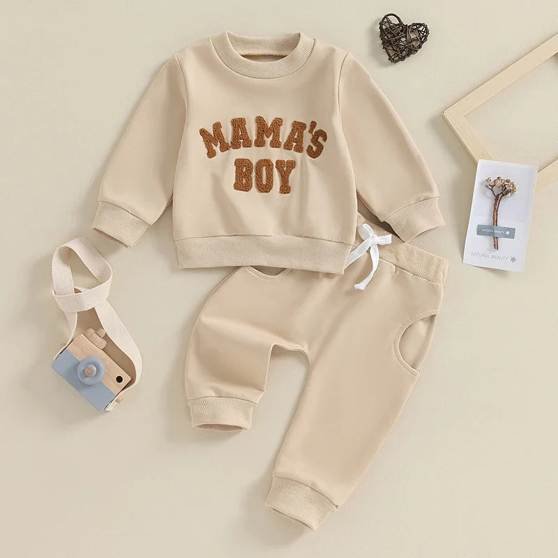 Gray toddler boy fall winter outfit set by August + Willow with long sleeve letter mama's boy crewneck top and jogger pants.