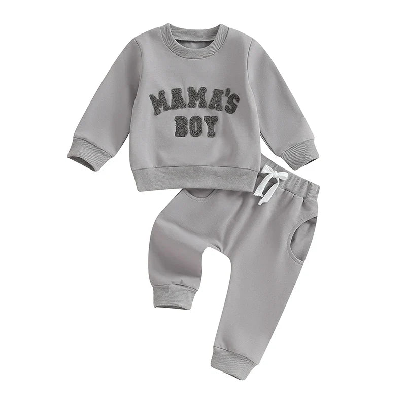 Gray toddler boy 2-piece fall winter outfit set with long sleeve letter mama's boy crewneck top and jogger pants by August + Willow.