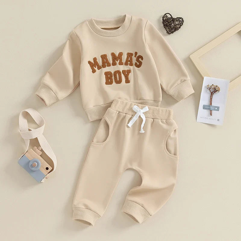 Gray toddler boy fall winter outfit set by August + Willow with long sleeve letter mama's boy crewneck top and jogger pants.