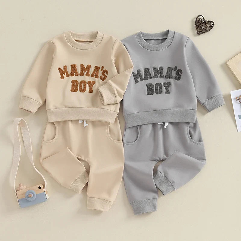 Gray toddler boy fall winter outfit set with long sleeve letter mama's boy crewneck top and jogger pants by August + Willow.