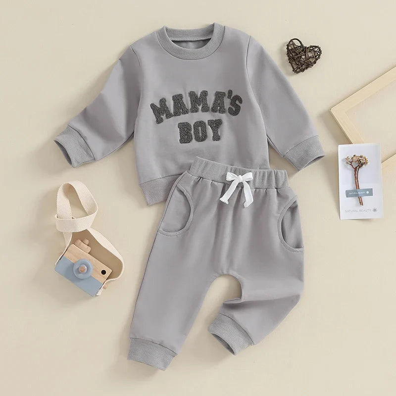 Gray toddler baby boy fall winter outfit set by August + Willow with long sleeve letter mama's boy crewneck top and jogger pants.