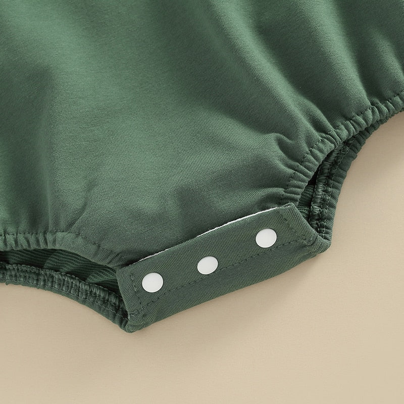 Adorable green long-sleeve baby romper by August + Willow for boys and girls, perfect for newborns and infants.
