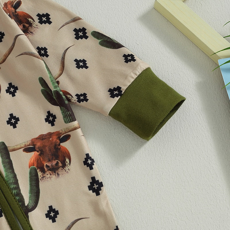 Baby jumpsuit with long sleeves featuring cow and horse print, zipped closure, perfect for autumn, by August + Willow.
