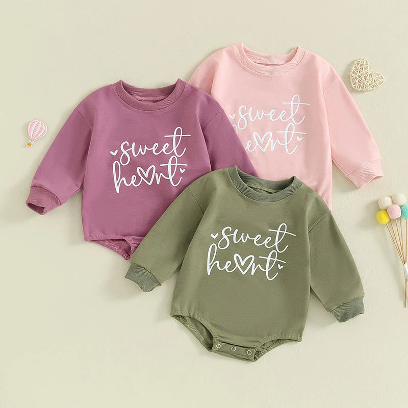 Baby girls and boys Valentine's Day long sleeve bubble romper by August + Willow with sweet heart letter print, suitable for 0-3 months.