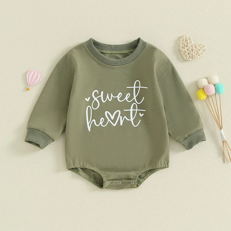 Baby girls and boys Valentine’s Day long sleeve bubble romper by August + Willow with sweet heart letter print, suitable for infants 0-3 months.