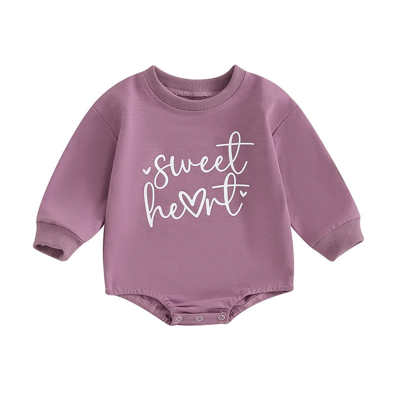 Baby girls and boys Valentine's Day long sleeve bubble romper by August + Willow with heart and letter design for infants 0-3 months.