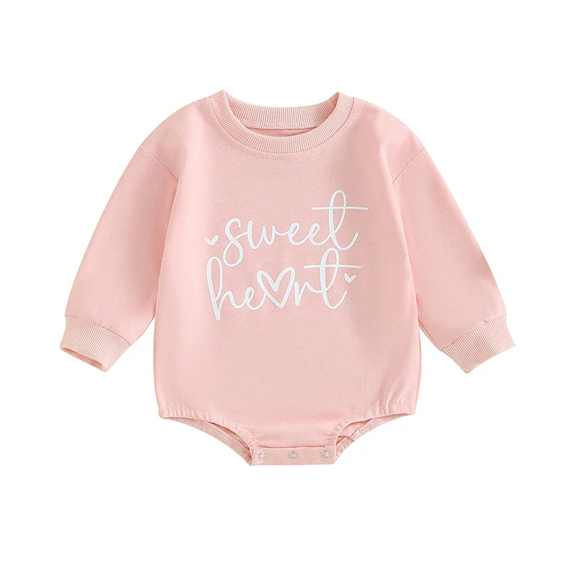 Baby girls and boys Valentine’s Day long sleeve bubble romper by August + Willow with sweet heart letter print, suitable for ages 0-3 months.