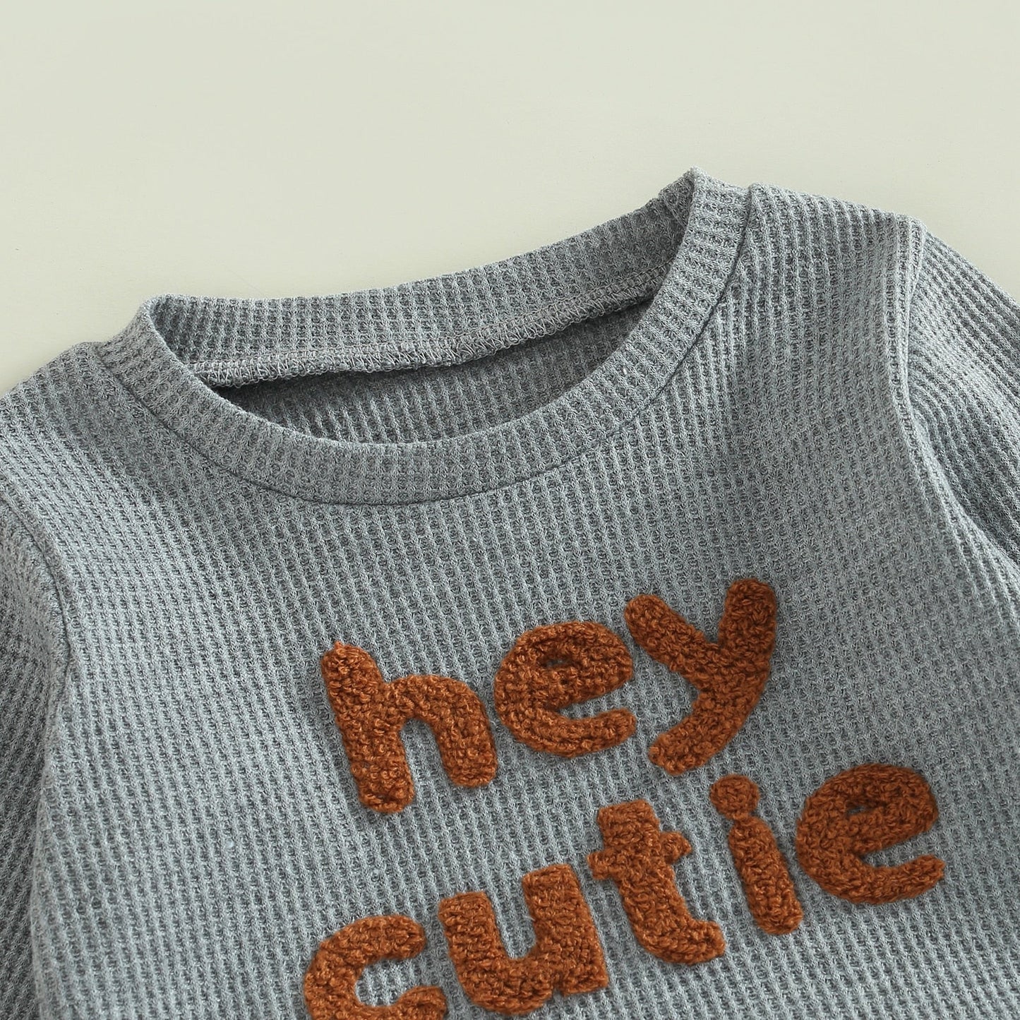 Grey 2-piece baby toddler outfit by August + Willow with long sleeve ribbed knit tops and matching pants for girls and boys.