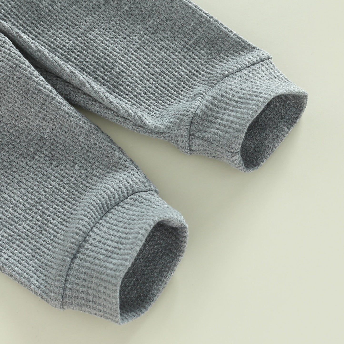 Gray 2-piece toddler outfit from August + Willow with long sleeve ribbed knit tops and pants for baby girl or boy.