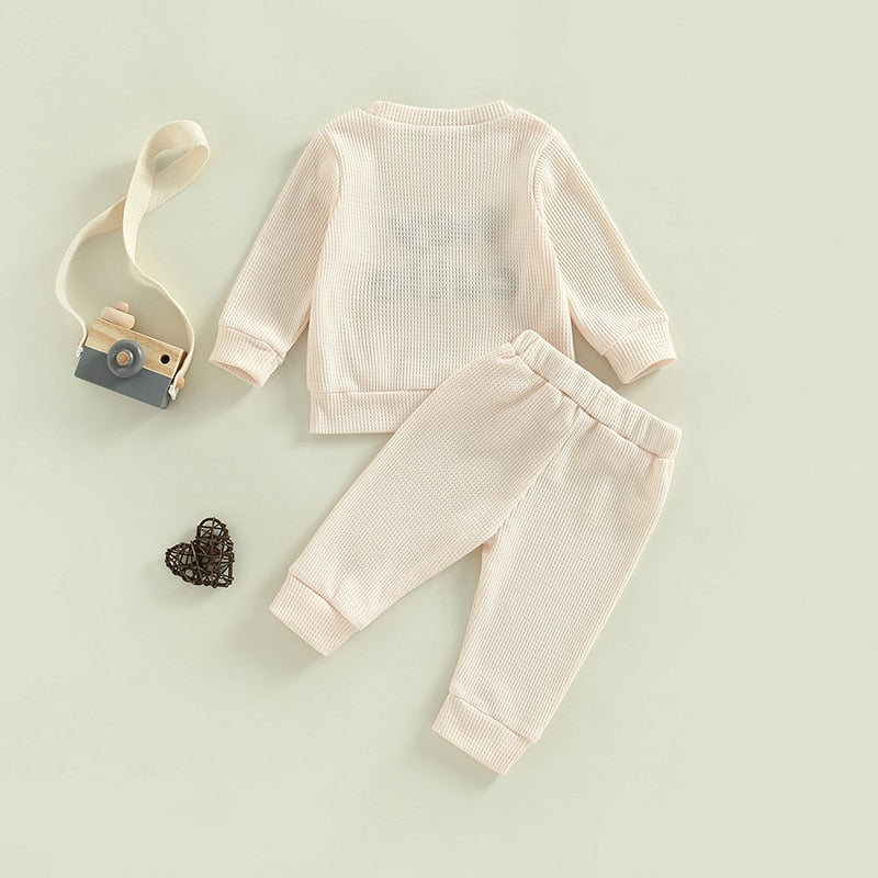 Gray 2-piece baby toddler outfit by August + Willow with long sleeve ribbed knit tops and matching pants for boys and girls.