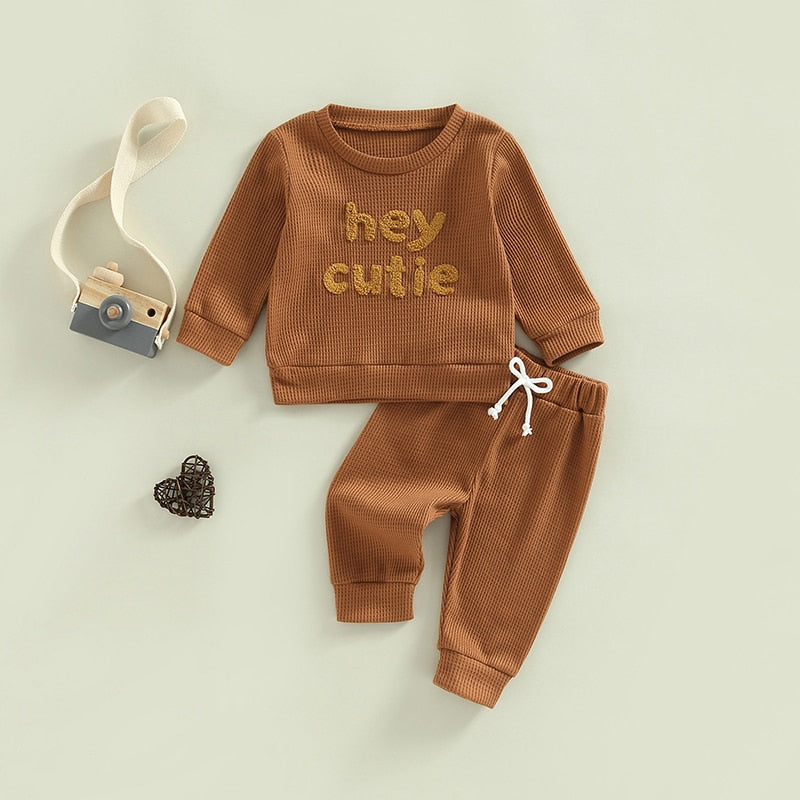 Grey 2-piece baby and toddler outfit by August + Willow featuring long sleeve ribbed knit tops and pants for girls and boys.