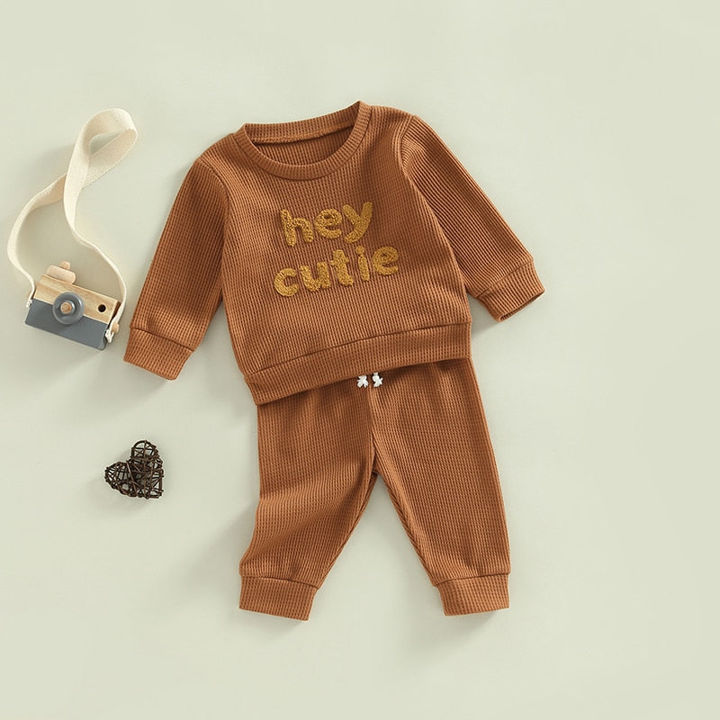 Grey 2-piece baby and toddler outfit by August + Willow featuring long sleeve ribbed knit tops and pants for girls and boys.