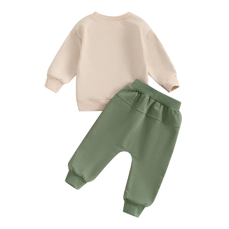 Baby boy fall outfit by August + Willow, khaki 2-piece set with tractor and letter print long sleeve top and matching pants.