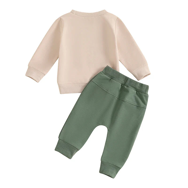 Baby boy fall 2-piece outfit set with tractor print long sleeve top and drawstring pocket pants by August + Willow.