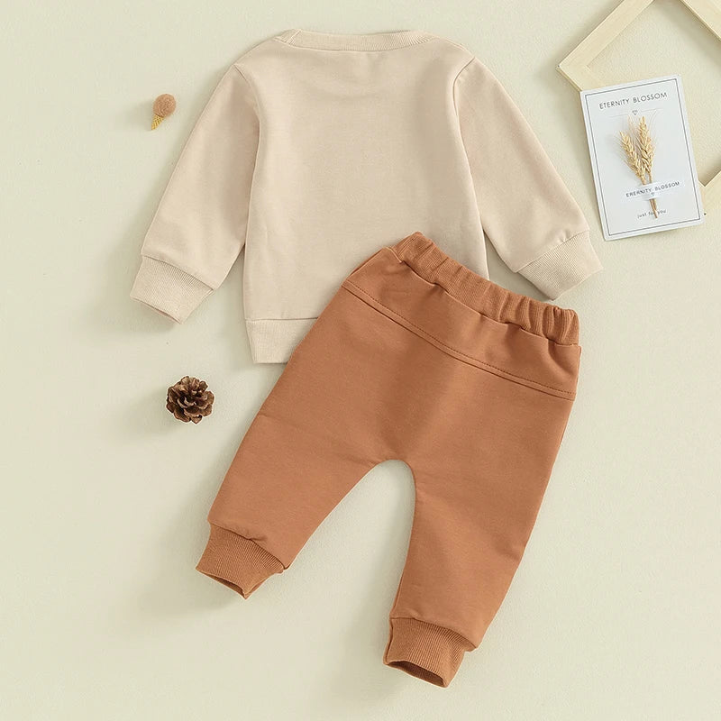 Baby toddler boys and girls 2-piece khaki outfit with letter Auntie's Little Bestie print, long sleeve pullover and jogger pants by August + Willow.