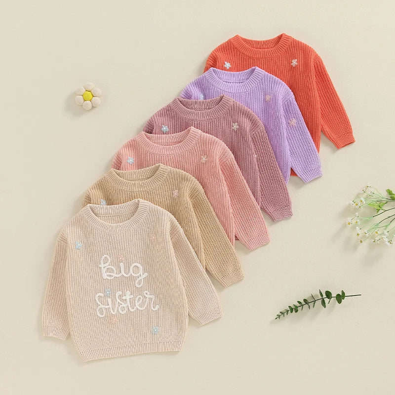 Light pink toddler girl's big sister sweater by August + Willow with long sleeves and cute letter embroidery, knit pullover for girls.