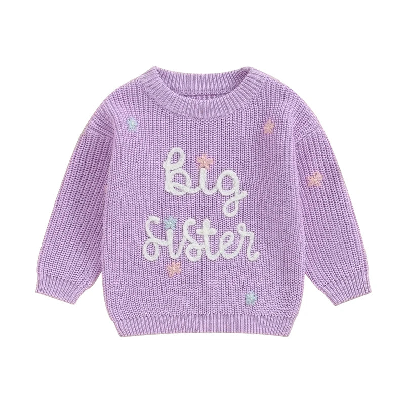 Light pink toddler girl sweater by August + Willow with long sleeves, letter embroidery, and a cozy knit, perfect for little sisters.