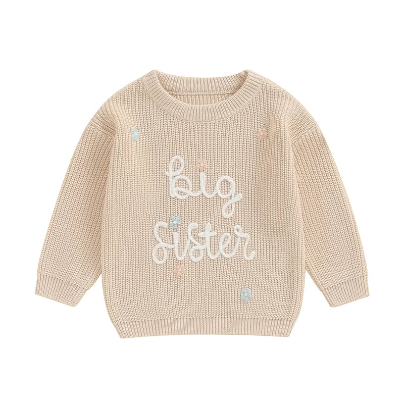 Light pink toddler girl sweater from August + Willow featuring long sleeves, letter embroidery, and a cozy knit design.