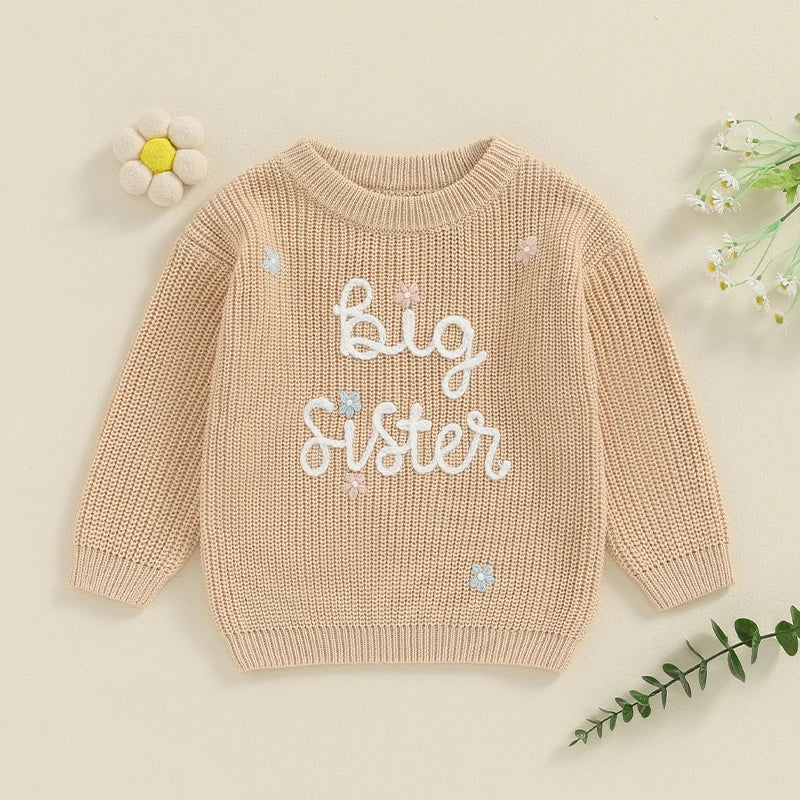 Light pink toddler girl sweater from August + Willow with long sleeves, letter embroidery, and a loose fit, perfect for baby and toddler outfits.
