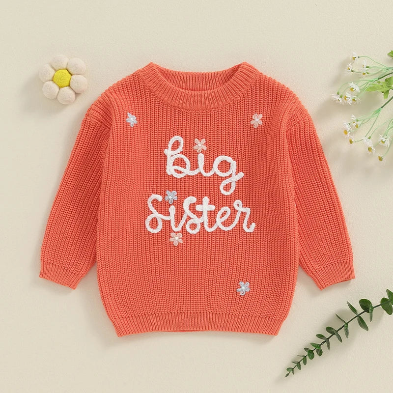 Light pink toddler girl sweater from August + Willow with long sleeves, letter embroidery, and a loose fit, perfect for baby and toddler outfits.