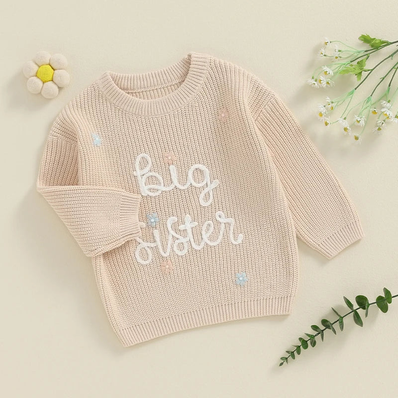 Light pink toddler girl sweater by August + Willow with long sleeves and cute embroidered letter design, perfect for casual wear.