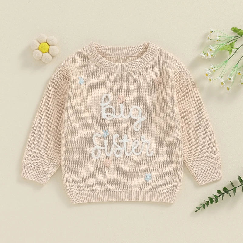 Light pink toddler girls' big sister sweater with long sleeves, letter embroidery, and a cozy knit pullover from August + Willow.