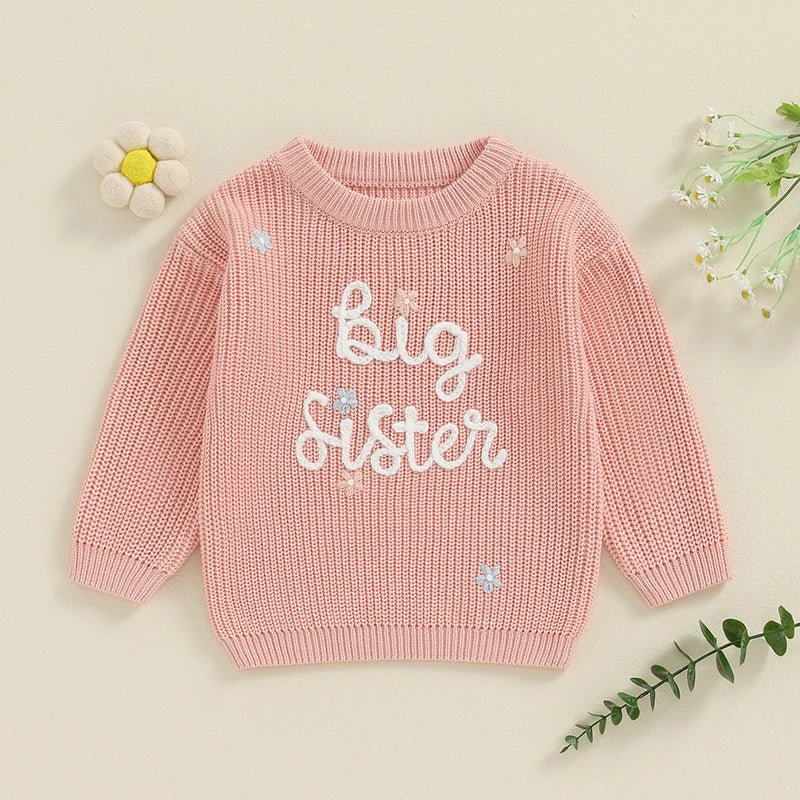 Light pink toddler girl sweater from August + Willow with long sleeves, letter embroidery, cozy knit, perfect for big sisters.